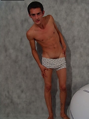 Skinny twink Jon bares the meaty love rod hiding under his baggy boxers