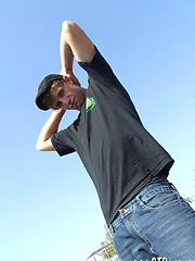 Handsome twink guy posing for the camera outdoors