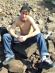 Handsome twink guy posing for the camera outdoors
