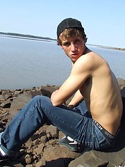 Handsome twink guy posing for the camera outdoors