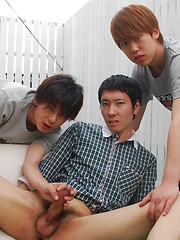 Kaede and Fuji grab the lube and a dildo and bend Jo over the small couch pulling off his shorts